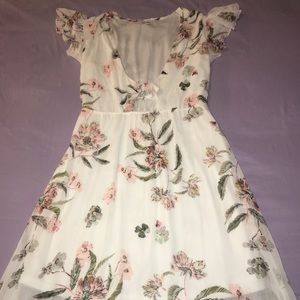 A MAXI DRESS WITH FLOWER DETAILS